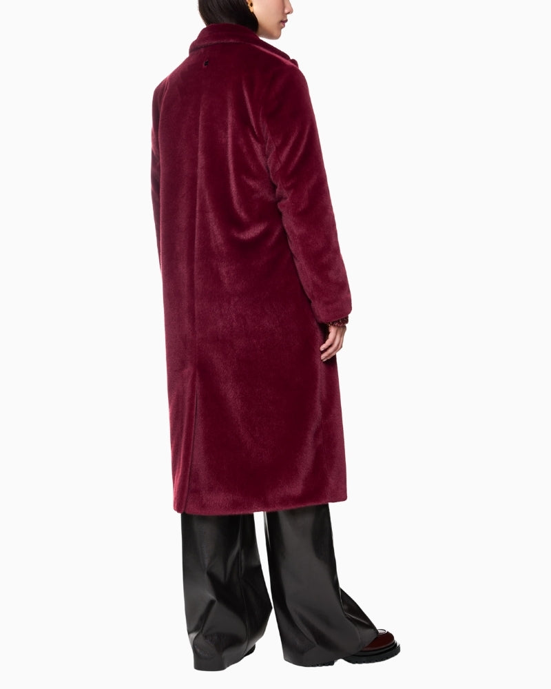 Back view of cosy winter coat with classic collar and relaxed silhouette