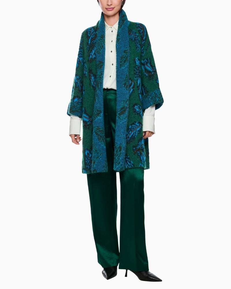 Model view of relaxed fit cape coat with draped shawl collar