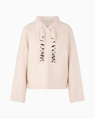 Front view of loose-cut sweatshirt with wide sleeves and soft fabric