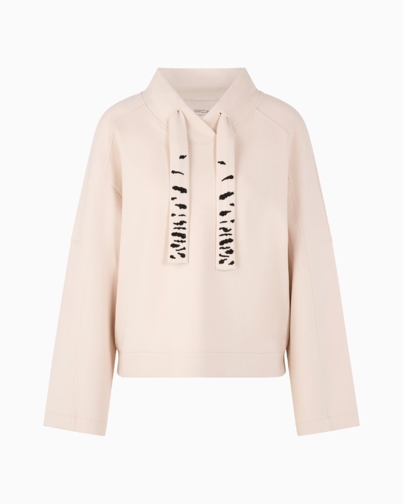 Front view of loose-cut sweatshirt with wide sleeves and soft fabric