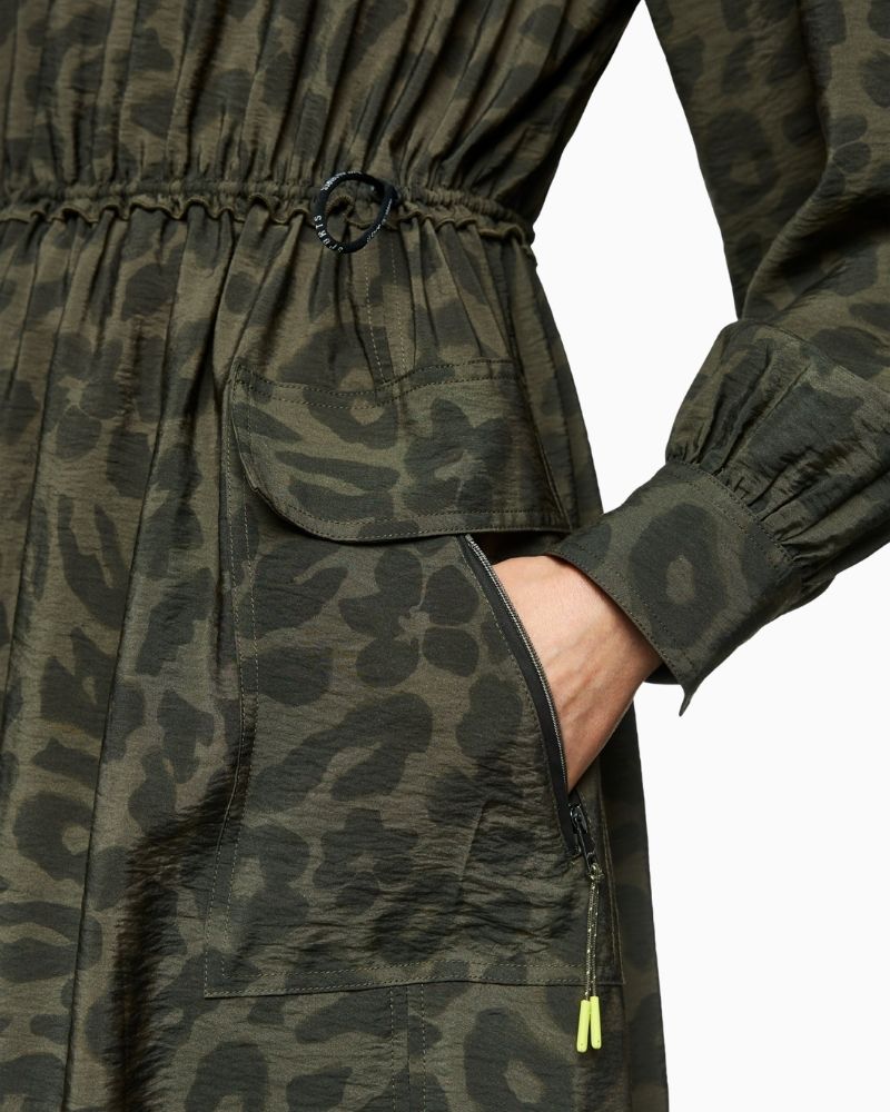 Close up of Marc Cain olive maxi dress with zip neckline, patch pockets and drawstring waist