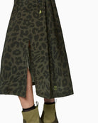 Close up of Marc Cain olive maxi dress with zip neckline, patch pockets and drawstring waist