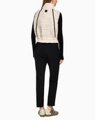 Back of Marc Cain quilted vest showing gathered waist and feminine shape