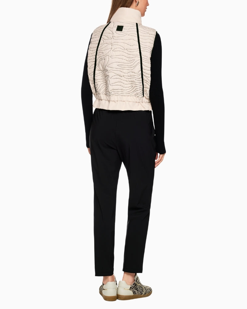 Back of Marc Cain quilted vest showing gathered waist and feminine shape