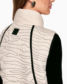 Back of Marc Cain quilted vest showing gathered waist and feminine shape