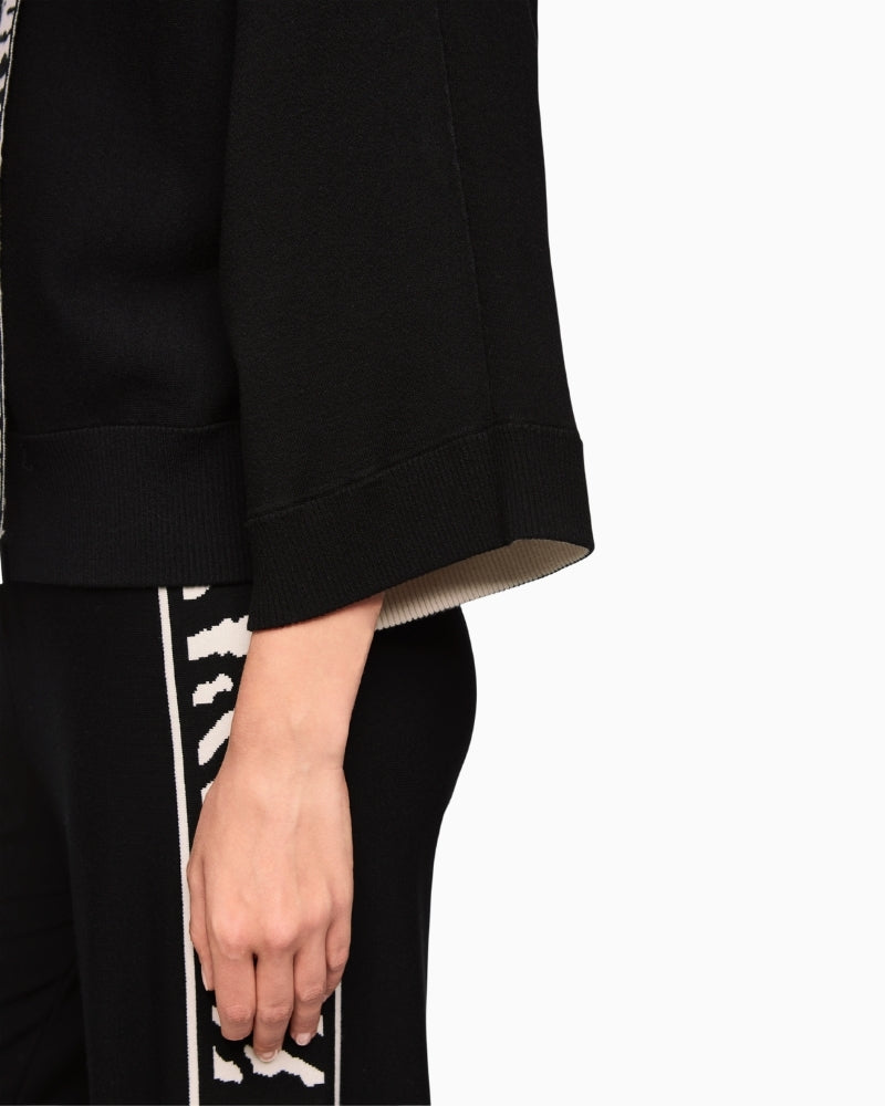 Close-up of animal print trim and bold stripe on hood