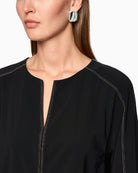 Close-up of soft stretch fabric in polyamide blend with V-neck cut