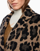 Close up  view showing length and reversible design of Marc Cain coat