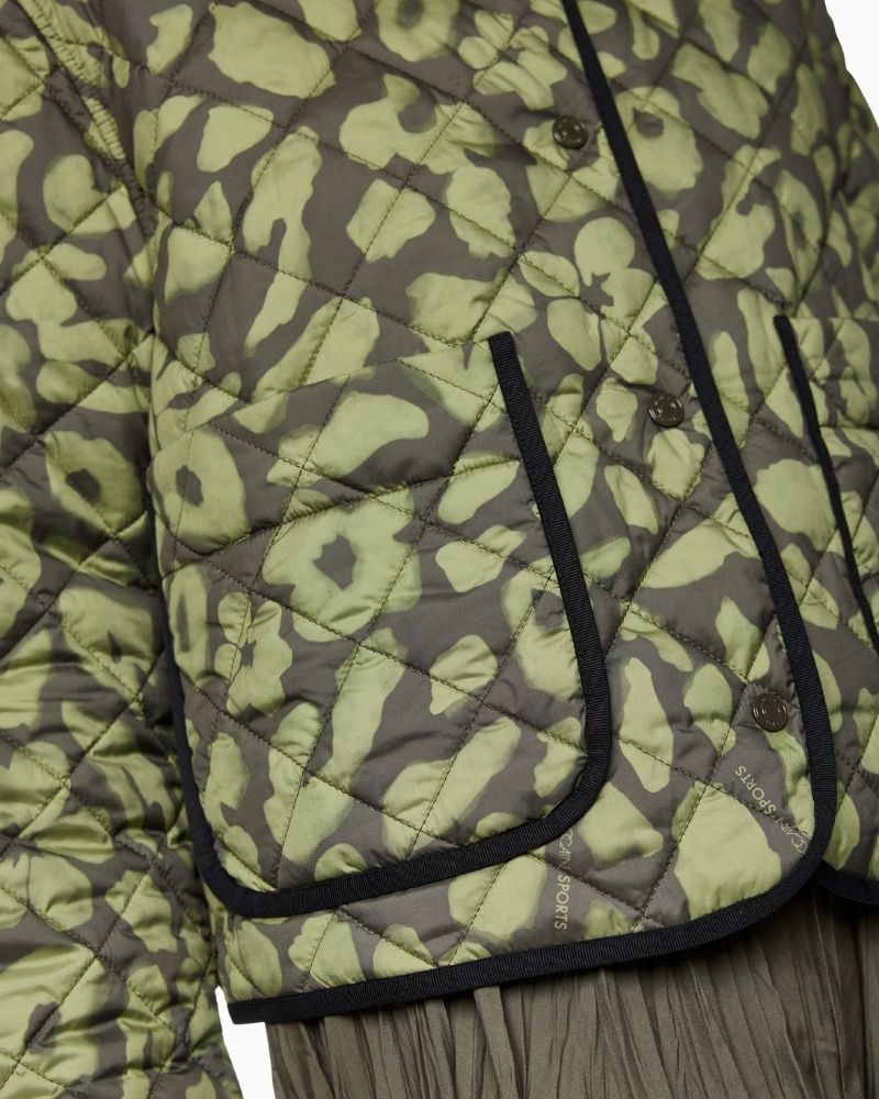 Close up of Reversible quilted jacket by Marc Cain in olive with leopard print side