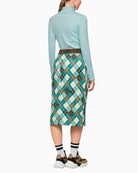 Back view of fitted long-sleeved top showing stretch comfort