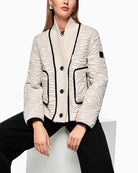 Front view of boxy short jacket with ribbed knit collar and button fastening