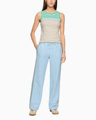 Woman wearing Marc Cain sleeveless striped top with light trousers full view – Áines Boutique