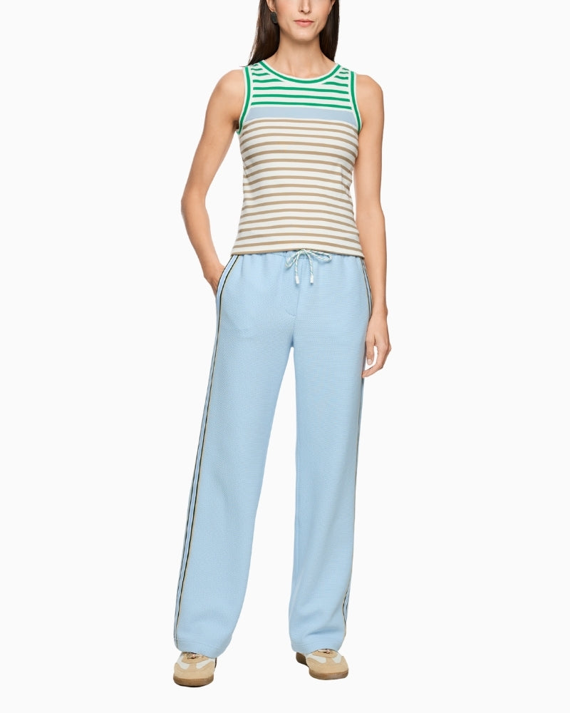 Woman wearing Marc Cain sleeveless striped top with light trousers full view – Áines Boutique