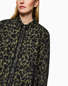 Close up of Marc Cain cropped jacket in olive drab with floral leopard print and zip front
