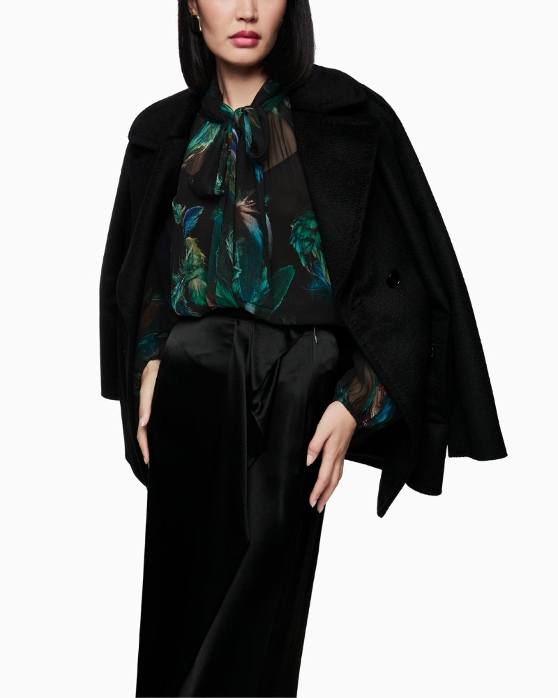 Sheer feather-print blouse by Marc Cain with bow tie neckline and loose fit