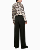 Back view of tailored viscose trousers with clean finish and fluid fit
