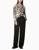 Front view of Marc Cain WICHITA high waist wide fit trousers with press creases and side pockets
