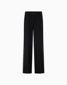 Front view of extra-long wide trousers with crease detail and drawstring waist