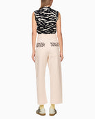 Back view of cream culottes showing animal print pocket detail