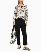 Marc Cain WUXI trousers styled casually with trainers and tee