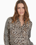 Close-up of shirt collar and leopard stripe patchwork fabric