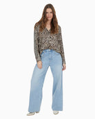 Styled blouse paired with tailored trousers for a dressy yet comfortable outfit