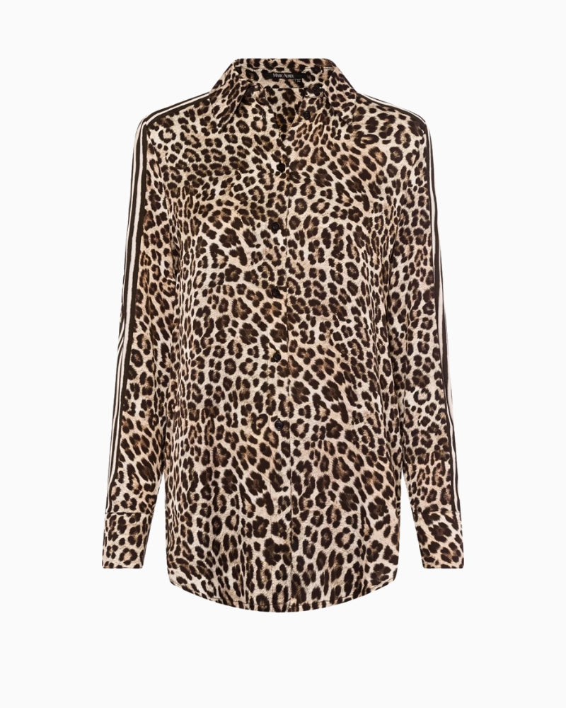 Front view of relaxed-fit blouse showing stripe details and buttoned cuffs