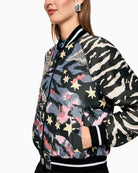 Marc Cain blouson jacket with comic print black side view on woman wearing it – Áines Boutique