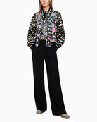 Marc Cain blouson jacket with comic print black model wearing jacket full length – Áines Boutique