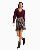 Model wearing cropped cashmere knit with leopard skit