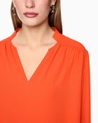 Marc Cain Flowing Blouse in Orange V-neck detail