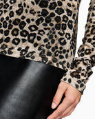 Close-up of soft cappuccino leopard print fabric in semi-transparent finish