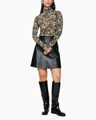 Marc Cain sheer leopard top styled with trousers – dressy outfit idea