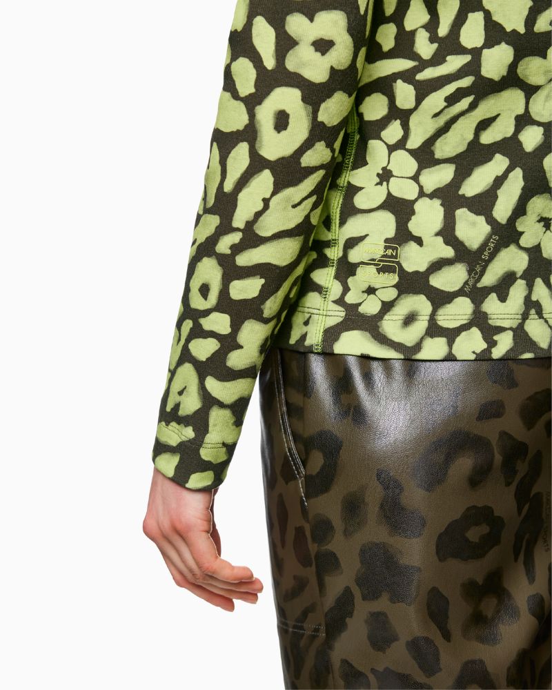 Close-up back view of lime animal print jersey fabric