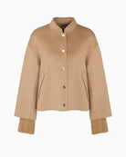 Flat lay of Marc Cain sand jacket showing press stud closure and collar shape
