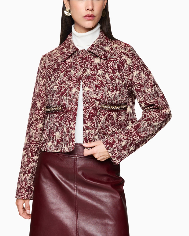 Front view of Marc Cain short embroidered jacket in bright maroon cotton blend