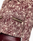 Front patch pocket with decorative jewellery-style trim