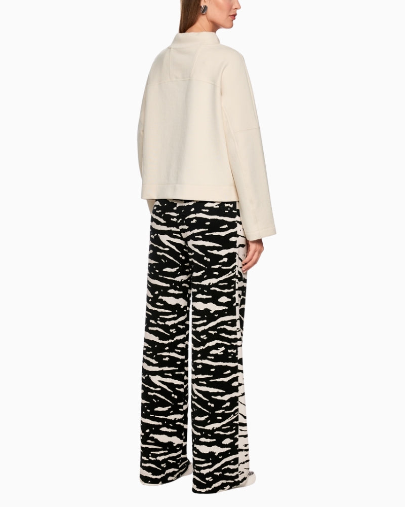 Marc Cain WELKOM wide-leg trousers with animal print black back view on woman wearing them – Áines Boutique