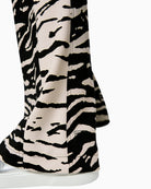 Marc Cain WELKOM wide-leg trousers with animal print black hem and leg detail – Áines Boutique