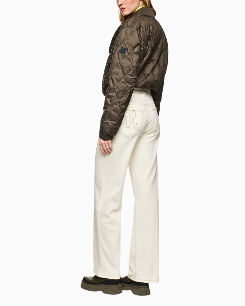 Side view of wide-leg puddle jeans covering the shoes