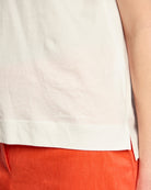 Marc Cain hibiscus print T-shirt off-white hem detail with side slits