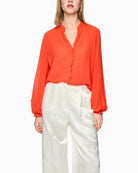 Marc Cain ruffle blouse bright tomato front view