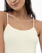 Close up of White slim fit spaghetti strap top by Mey with seamless sides