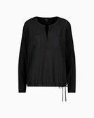 Front view of Monari black blouse with satin-look front and rhinestone neckline