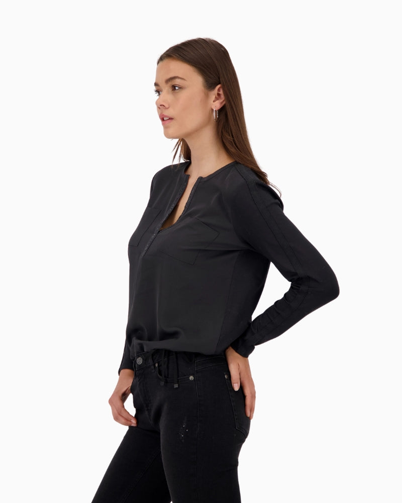 Side view showing sleeve stripe and relaxed drawstring hem