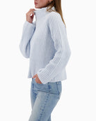 Side view of chenille sweater showing soft drape and texture