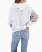 Back view of colourblock hoodie in off-white with long sleeves