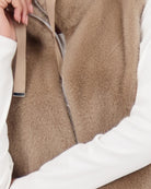 Close-up of fluffy faux fur texture and zip detail on Monari vest
