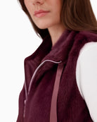 Close-up of plush faux fur texture on Monari taupe vest with zip detail