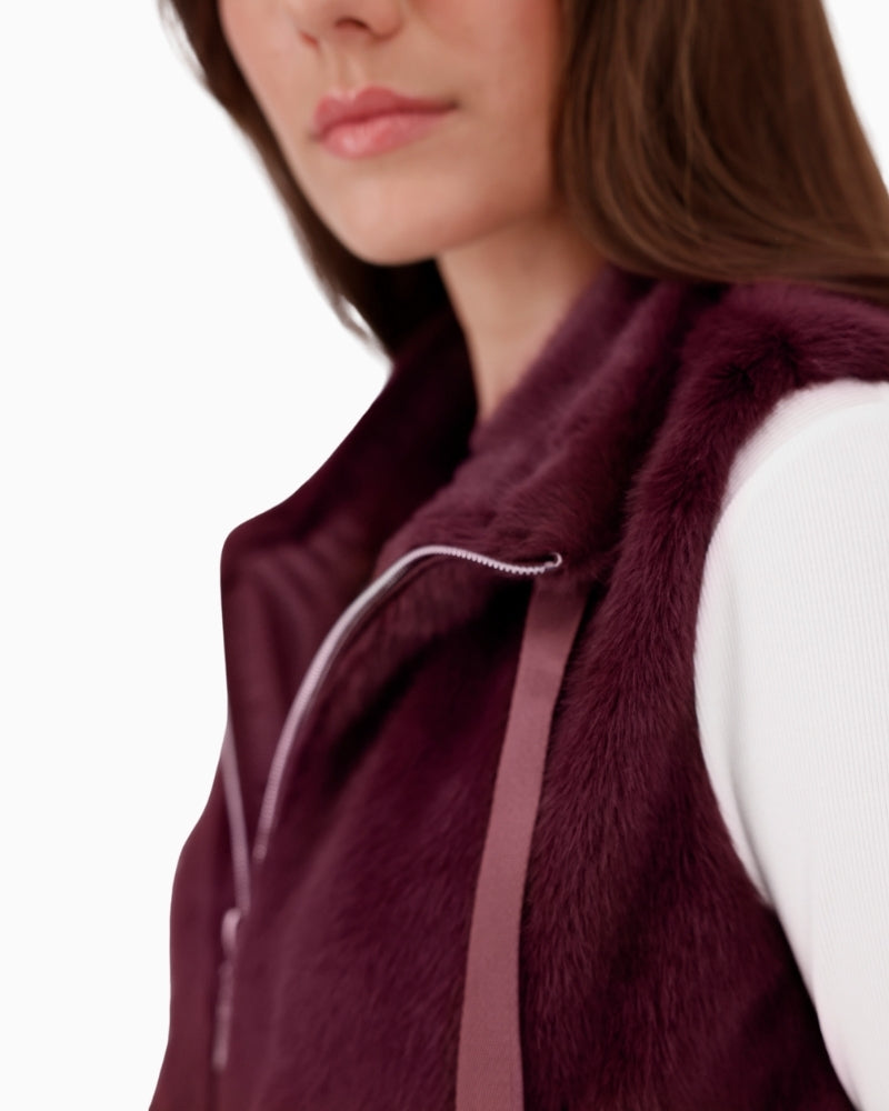 Close-up of plush faux fur texture on Monari taupe vest with zip detail